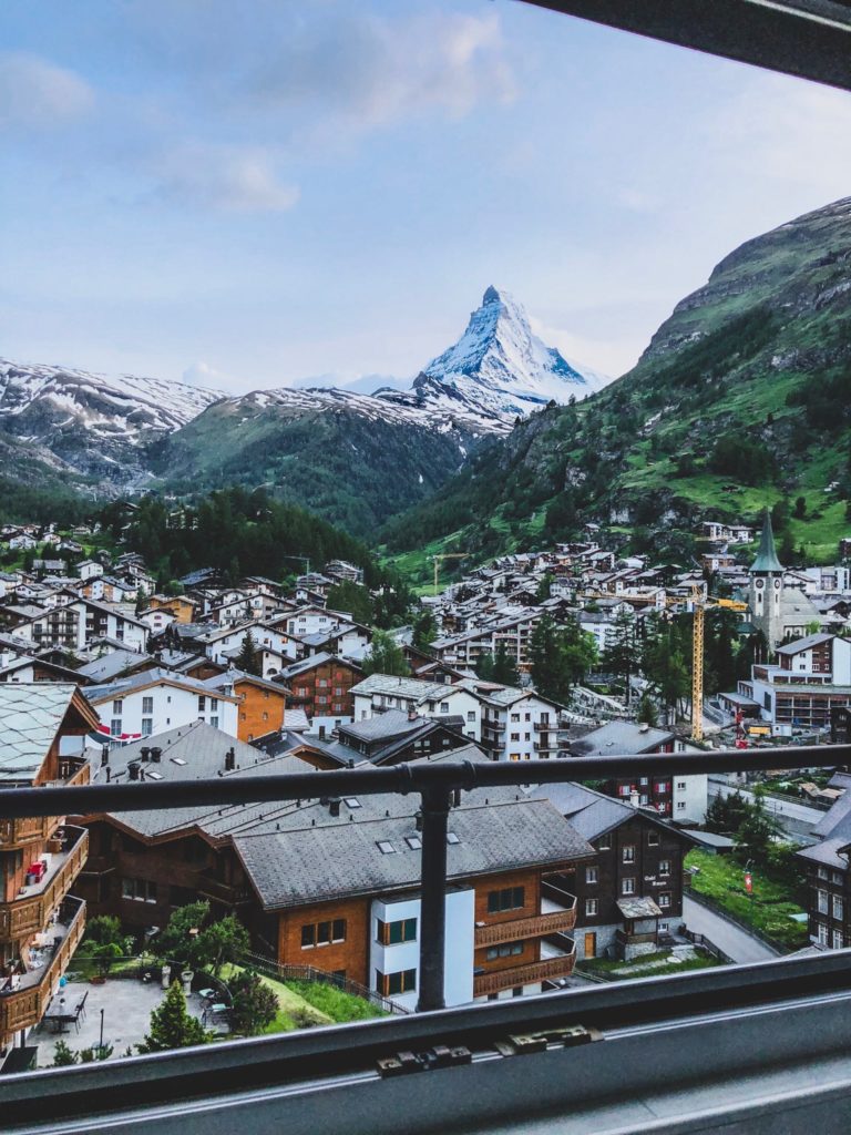 A student traveler's view of the cityscape of the mountain resort Zermatt with the iconic Matterhorn Mountain peak in the distance, located in Switzerland in this academic tours program.