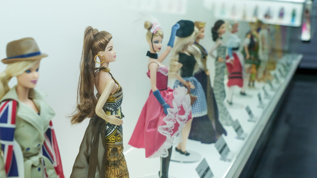 Featured in Barbie Film Locations by Students Fare this image shows a Barbie Expo display at downtown mall Les Cours Mont-Royal fashion stylish clothes of history Large fashion exhibit of Barbie Dolls on display
