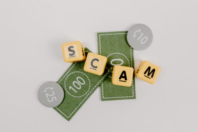 Featured in Tourist Scams To Avoid by Students Fare, this image shows fake money with the word scam written across it.