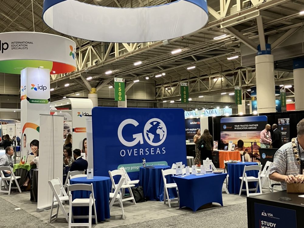 Many vendor tables at the NAFSA 2024 Annual Conference & Expo where Students Fare discussed tours, flights, hotels, and academic pursuits.