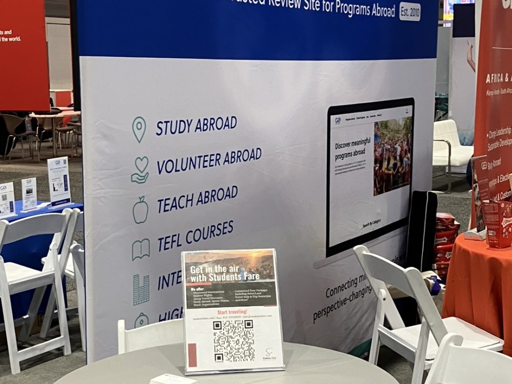 A banner at the table where the Students Fare team members attended the NAFSA 2024 Annual Conference & Expo to discuss tours, flights, hotels, and academic pursuits.