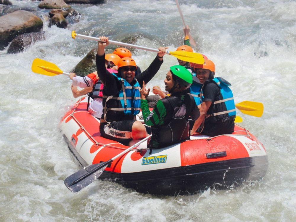 Several student travelers on a rafting tour of the Elo River in Desa Progowati, Magelang, Central Java, Indonesia.